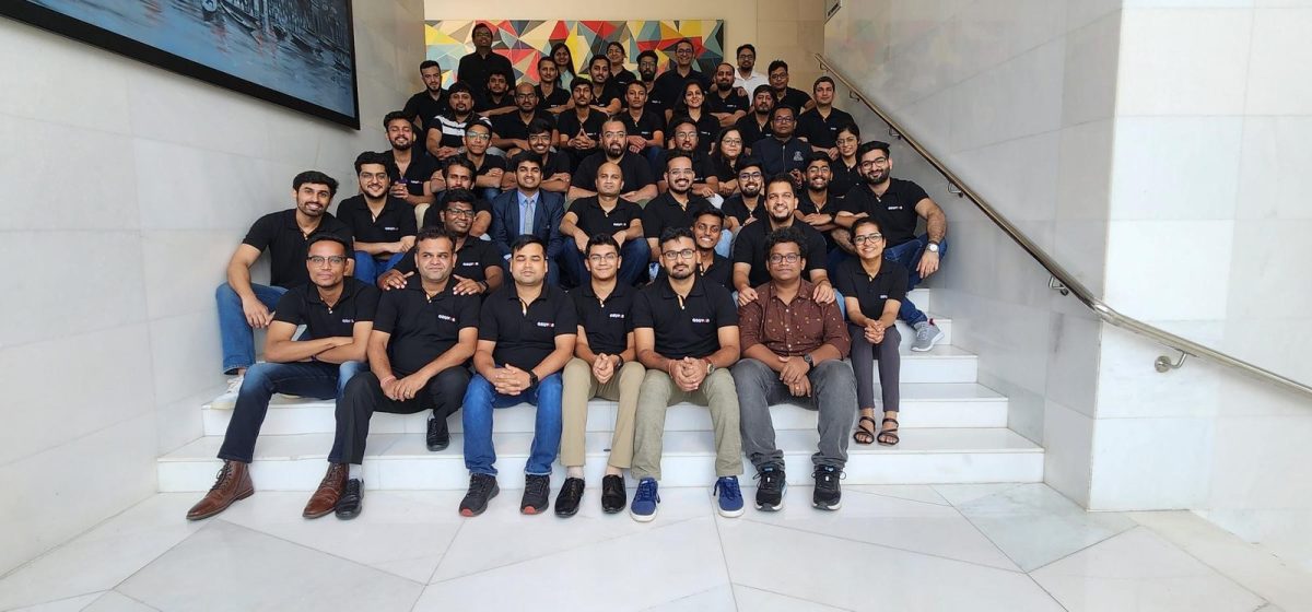 Team group photo on office stairs